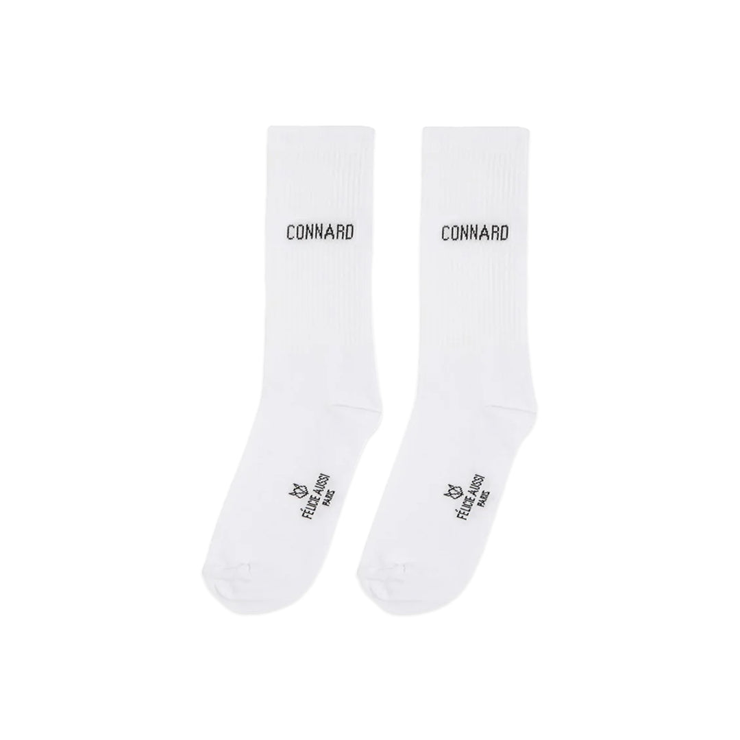 Paire de chaussettes blanches avec lettrage noir : "Connard"