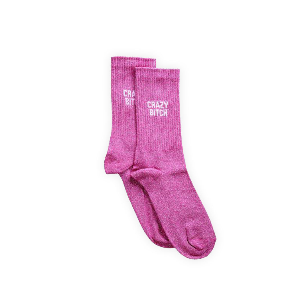 Paire de chaussettes à paillettes couleur rose avec lettrage blanc : "Crazy Bitch"