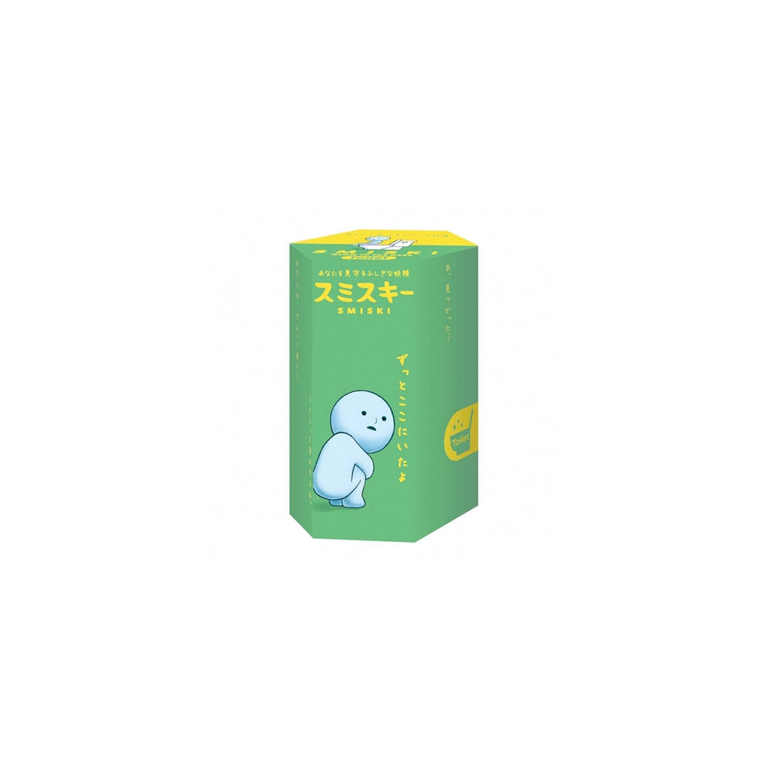 Boîte individuelle de figurine Smiski de la Série Toilettes, montrant un Smiski sur l'emballage avec un texte japonais et un design coloré.