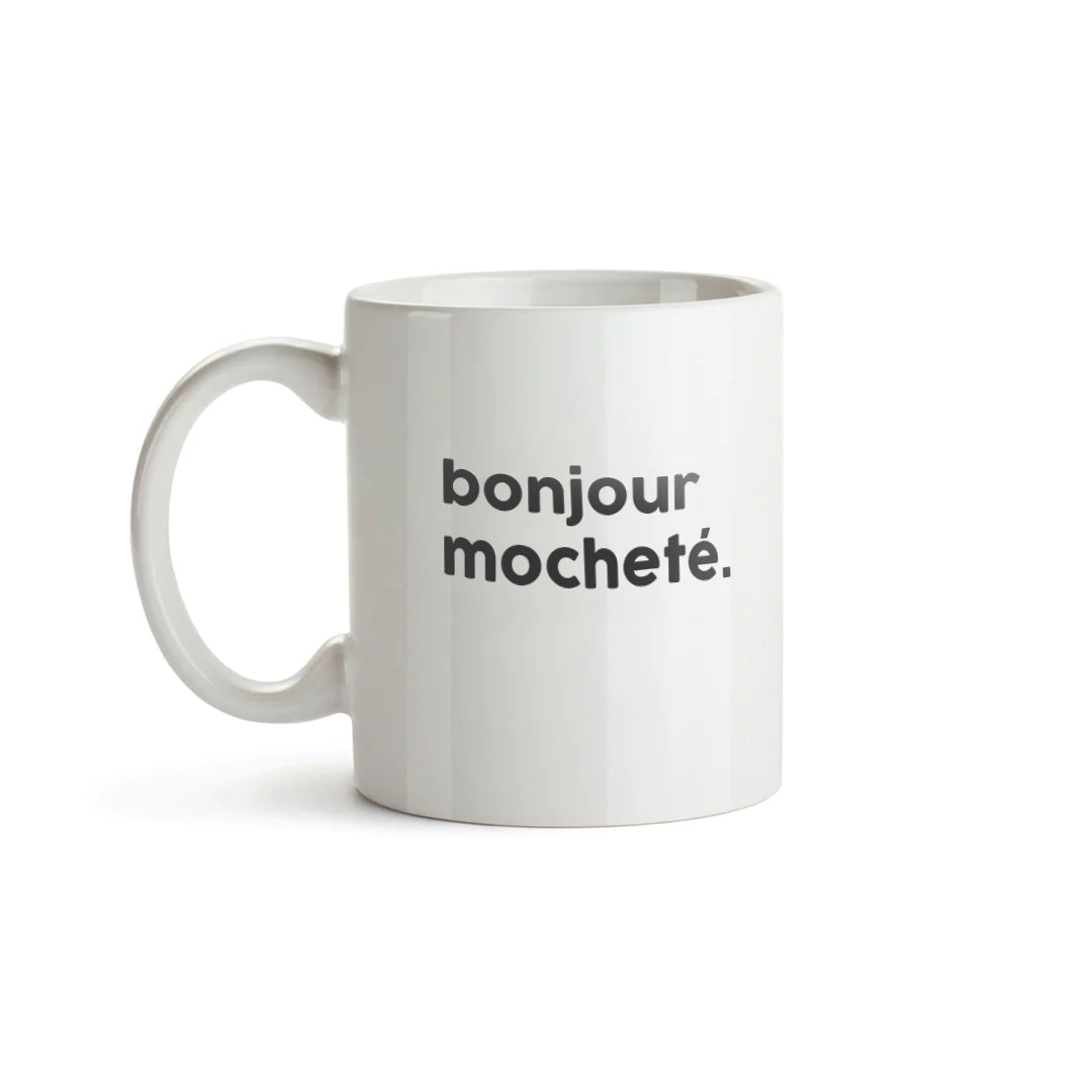 Mug blanc avec lettrage noir : "bonjour mocheté."
