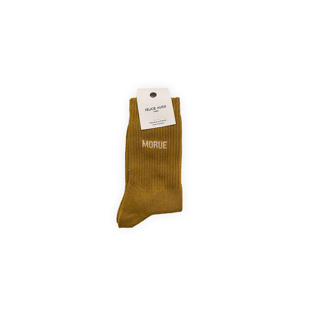 Paire de chaussettes à paillettes couleur moutarde avec lettrage blanc : "Morue"