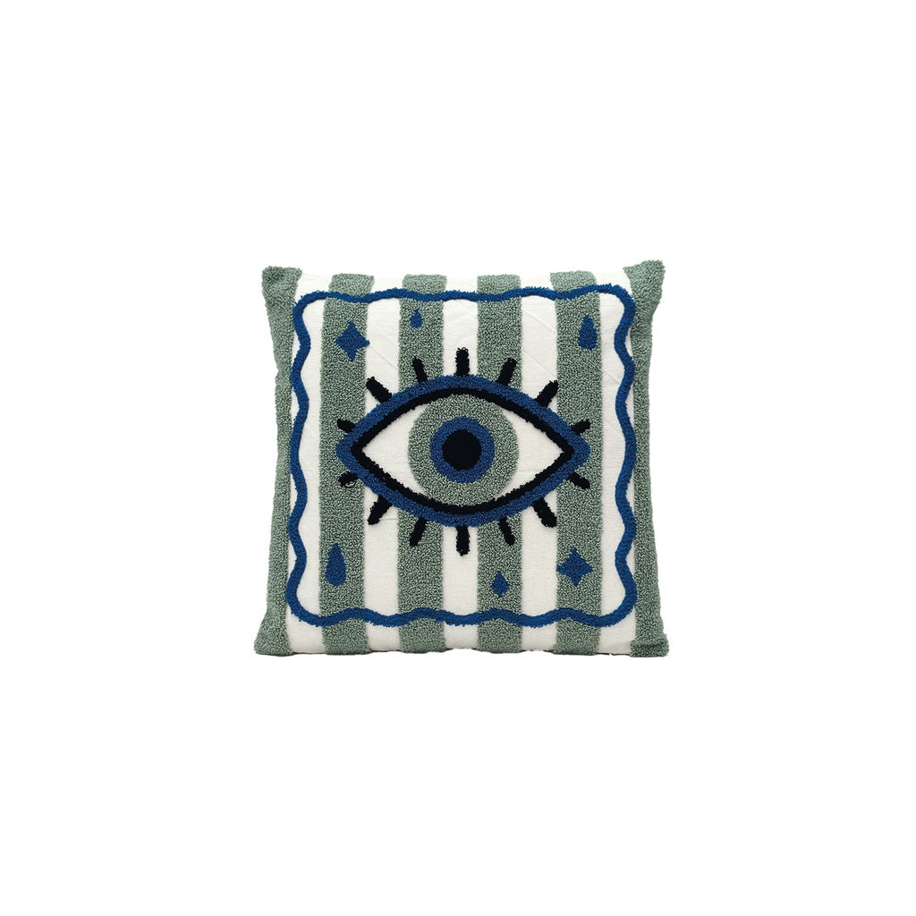Coussin brodé Œil bleu sur fond rayé vert et blanc.